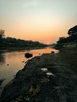 Beautiful view of a river lake at sunset photo