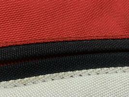 close up of red and black fabric texture background photo