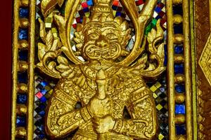 golden statue of a man in a temple photo