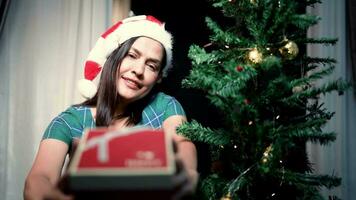 A woman stands waiting for a luxurious gift at the camera. video