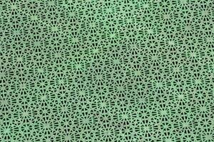 a green and white patterned fabric photo