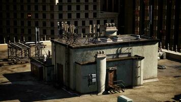 A building with a complex network of electrical equipment on its roof video