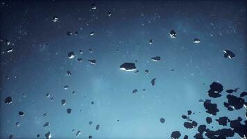 astratto cosmico sfondo con asteroidi e raggiante stelle video