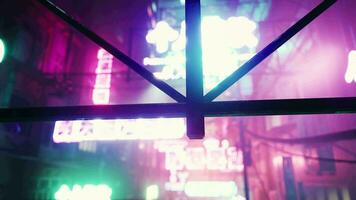 Soft blurred colorful light up Bokeh sign board along building in city nightlife video