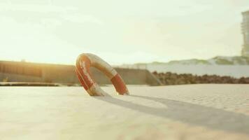 Lifebuoy on the city beach at sunset video