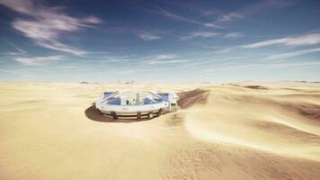 Enormous circular glass building standing alone in the desert video