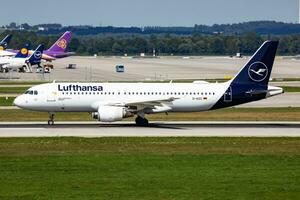 Lufthansa passenger plane at airport. Schedule flight travel. Aviation and aircraft. Air transport. Global international transportation. Fly and flying. photo