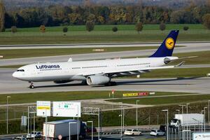 Lufthansa passenger plane at airport. Schedule flight travel. Aviation and aircraft. Air transport. Global international transportation. Fly and flying. photo