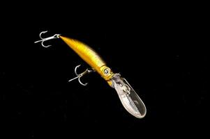 a fishing lure on a black background photo