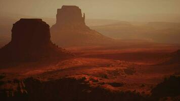 A majestic rock formation in the vast desert landscape captured from above video