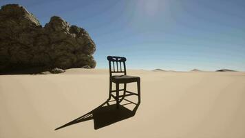 A chair sitting in the middle of a desert video