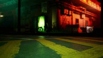 A green and yellow street sign sitting on the side of a road video