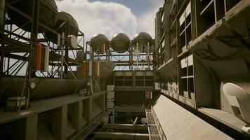 An industrial building with a concrete roof against a backdrop of the sky video