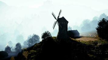 Countryside landscape with old windmill among hills video