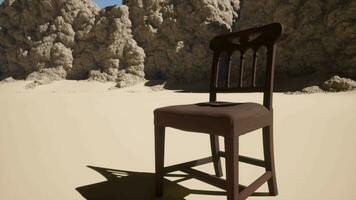 A chair sitting in the middle of a desert video