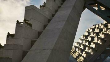 A modern concrete building against a clear blue sky video