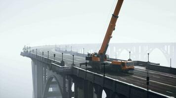 big auto crane on the bridge under constraction video