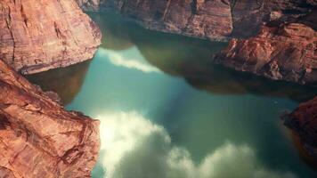 A serene mountain lake reflecting the surrounding peaks video