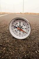 a compass on the road photo