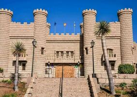 the castle is made of stone and has a large door photo