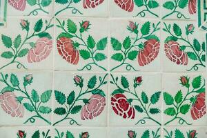 a close up of a floral pattern on a tile photo