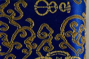 blue fabric with a gold design photo