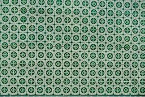 a green and white patterned wall photo