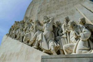 a ledge with carvings of people walking up photo