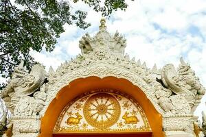 the entrance to a buddhist temple in thailand photo