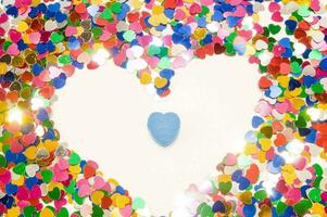 heart shaped confetti on white background with copy space photo