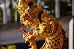 a golden dragon statue is on display outside photo