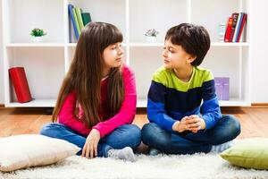 Two children are thinking what to play photo