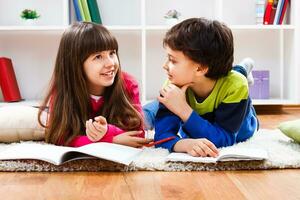 Children doing homework and talking photo