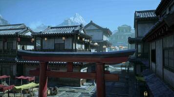 An oriental city with a red gate and mountains in the background video