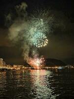 colorful fireworks in the night sky on the seafront of Alicante spain photo