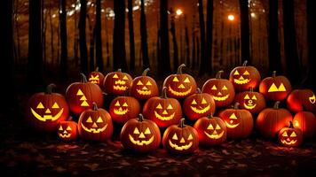 Halloween pumpkins in the forest at night. Halloween background with Evil Pumpkin. photo