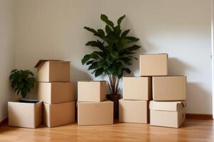 Smiling cardboard boxes and potted plant in empty room. photo