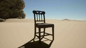 A chair sitting in the middle of a desert video