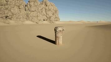 A stone pillar in the middle of a desert video