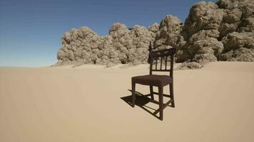 A chair sitting in the middle of a desert video