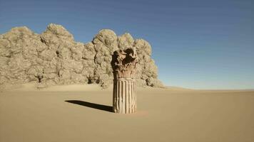 A stone pillar in the middle of a desert video