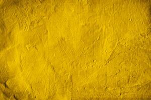 Fondo de textura de muro de hormigón amarillo foto