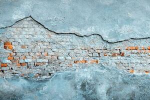 Peeling wallpaper. Old rough stone on cement pattern wall background. Vintage grunge plaster or concrete stucco surface. Natural material abstract structure backdrop. photo