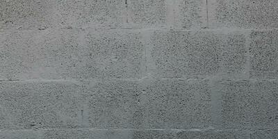 Grey cinderblock brick wall for background gray blockwork texture photo