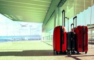 stack of traveling luggage in airport terminal photo