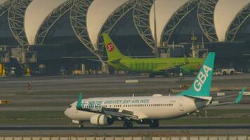 BANGKOK, THAILAND MARCH 01, 2023 Boeing 737 of Greater Bay Airlines landing, touching and braking at Suvarnabhumi Airport. Aircraft arriving. Spoilers up video