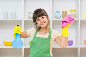 Happy little girl enjoys cleaning photo