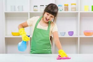 Happy little girl enjoys cleaning photo