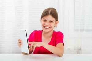 Little girl using digital tablet photo