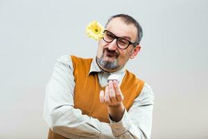 Self confident nerdy man is proposing his girlfriend photo